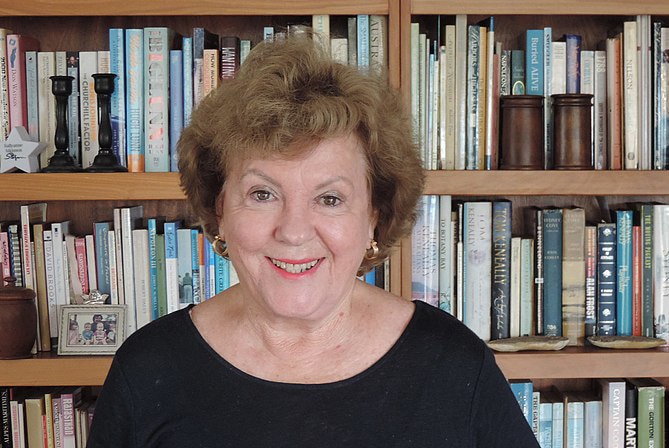 Sallyanne Atkinson standing in front of a bookshelf in 2017, location unknown.