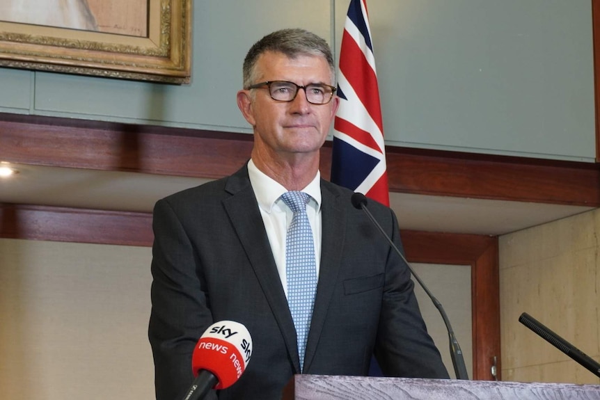 LNP Deputy Leader Tim Mander stands at a podium