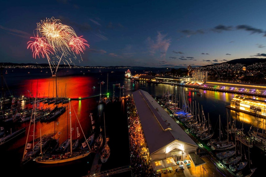 New Year's Eve fireworks explode in the sky at Hobart waterfront, near Taste of Tasmania event.