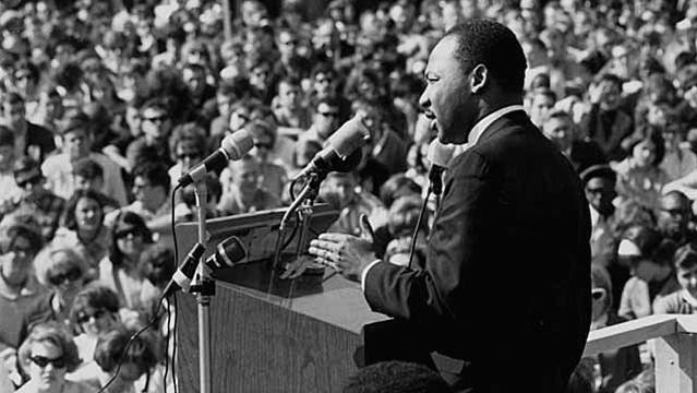 Martin Luther King stands at podium