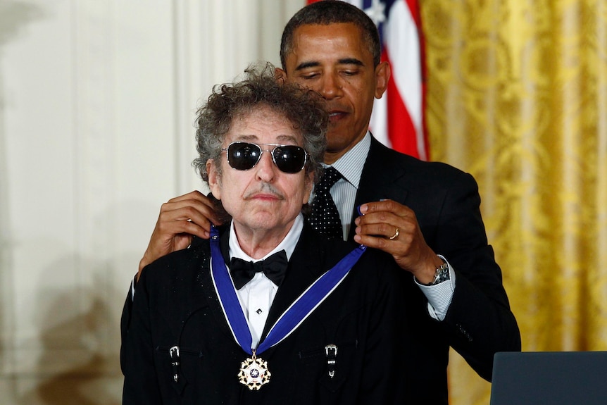 Barack Obama awards the Presidential Medal of Freedom to musician Bob Dylan at the White House.
