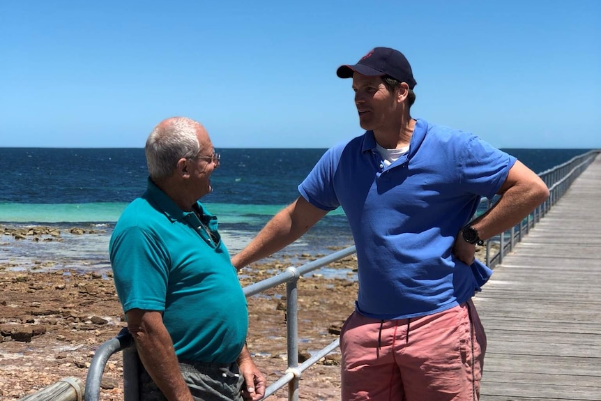 Two men on a jetty.