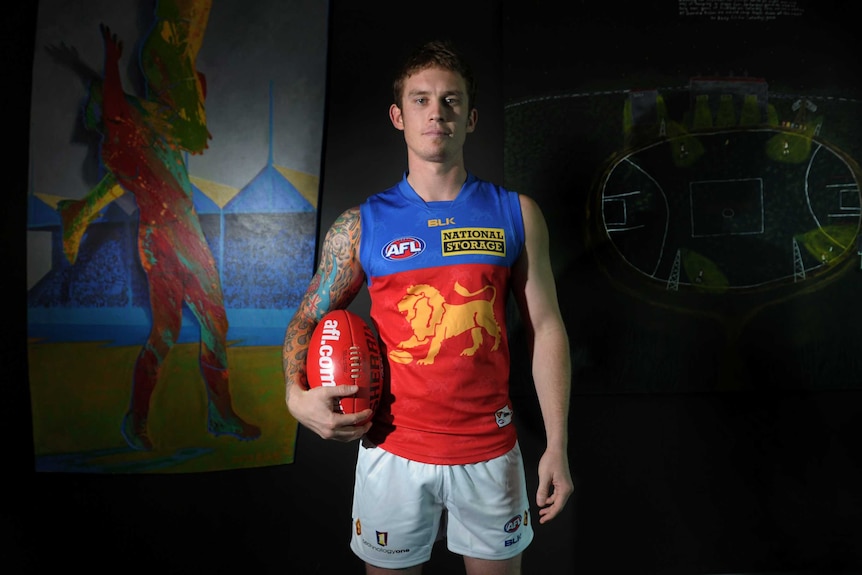 Dayne Beams poses in his new Brisbane Lions kit after joining the club in October 2014.