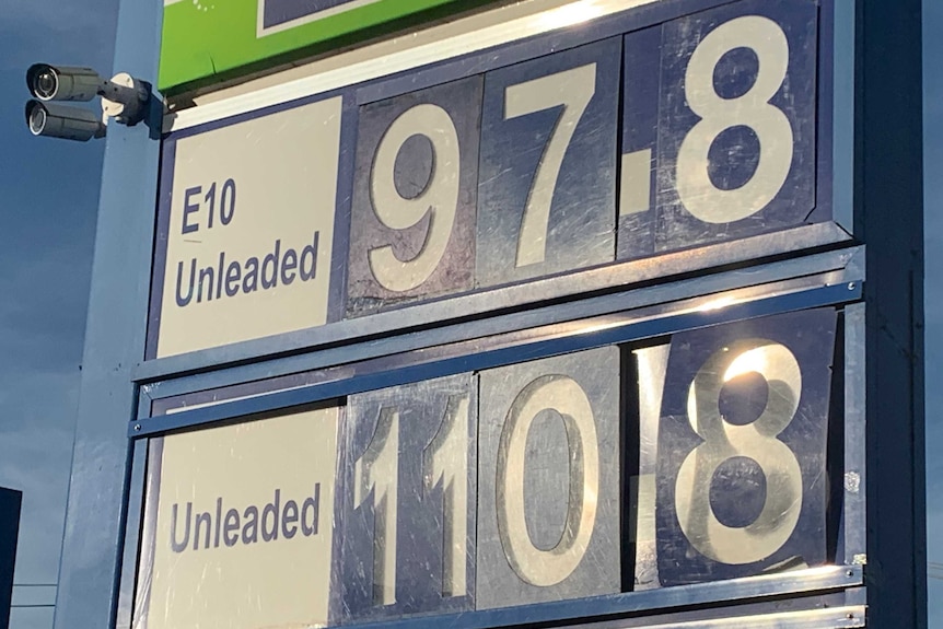 A blue petrol sign showing 97.8 and 110.8