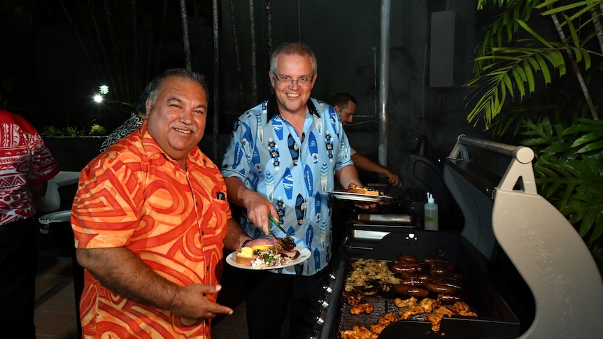 Narau's President Baron Waqa and Australia's Prime Minister Scott Morrison smile at a barbeque for Pacific Islands leaders.