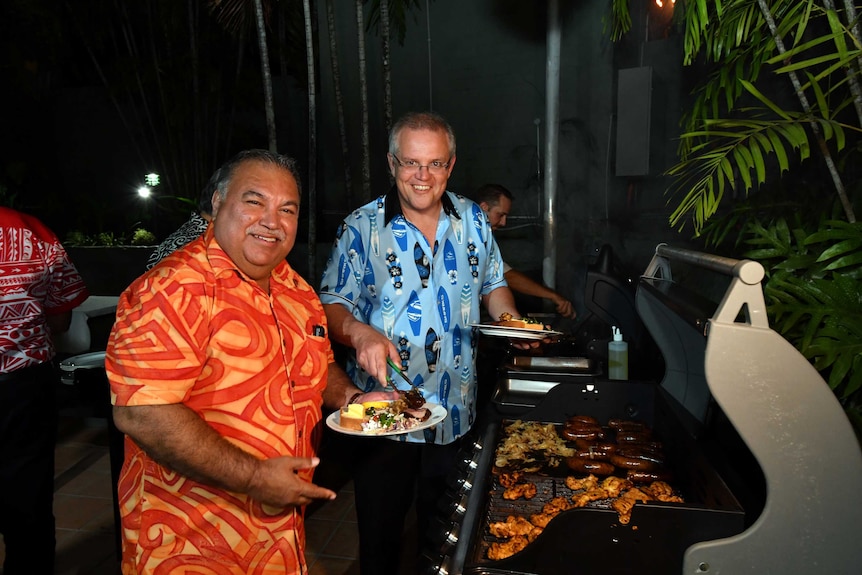 Narau's President Baron Waqa and Australia's Prime Minister Scott Morrison smile at a barbeque for Pacific Islands leaders.