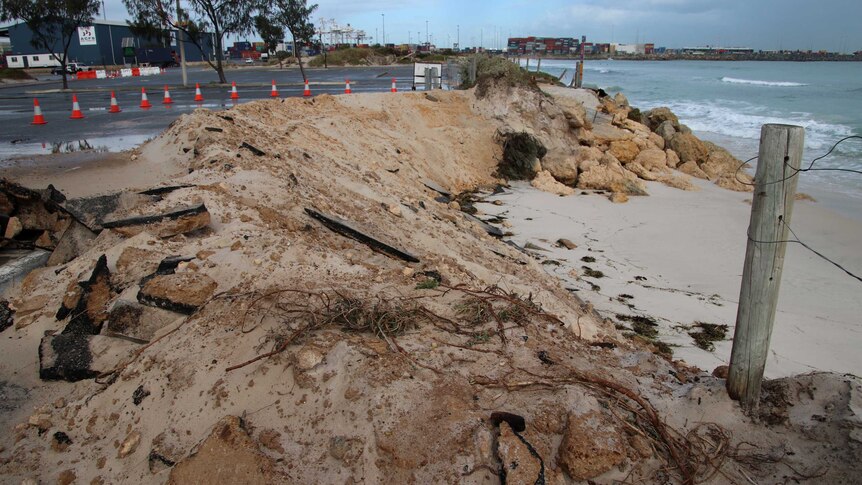 Erosion at Port Beach carpark Fremantle with witches' hats cordoning off parts of the bitumen.
