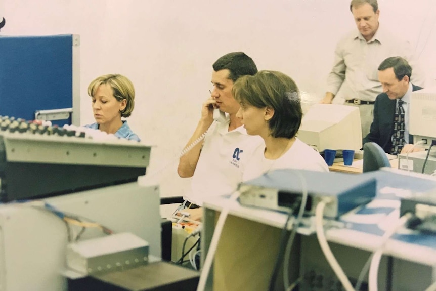 ABC teams including Jim Middleton on computers and phones.