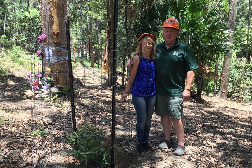 Matthew Leveson's parents, Mark and Faye plant trees at his burial site in the Royal National Park, south of Sydney.