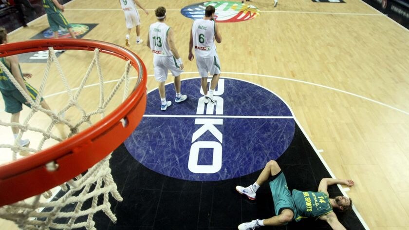 Brought back to earth... Australia's Matthew Nielsen lies on the court during Australia's defeat