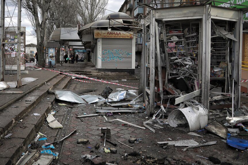 Damaged kiosks seen after a deadly Russian shelling that hit a bus station in Kherson.