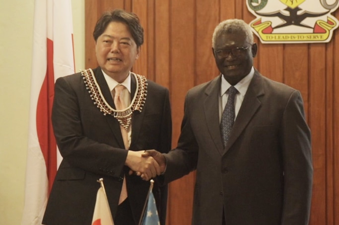 Hayashi Yoshimasa, Japan's minister for foreign affairs, with prime minster Mannaseh Sogavare on Sunday.