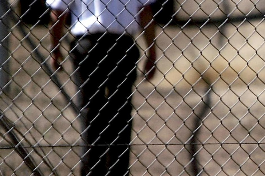 Security guards patrol the grounds at the Villawood Immigration Detention Centre. (Getty Images: Ian Waldie, file photo)