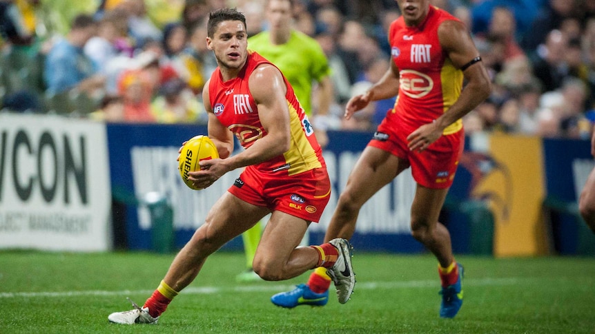 Dion Prestia with the ball