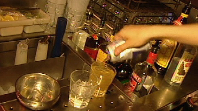 Generic TV still of glasses on bar at nightclub in Brisbane, date unknown.