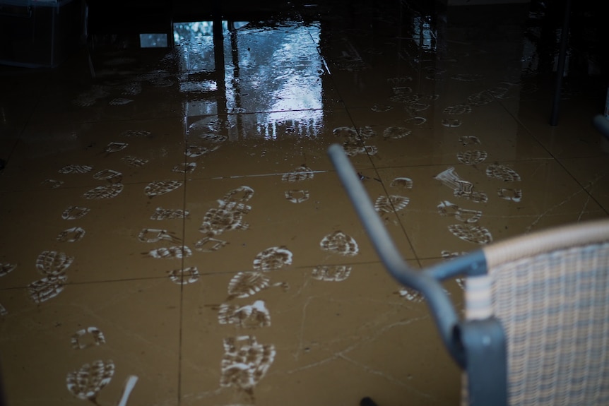 Footprints in mud covering tiles