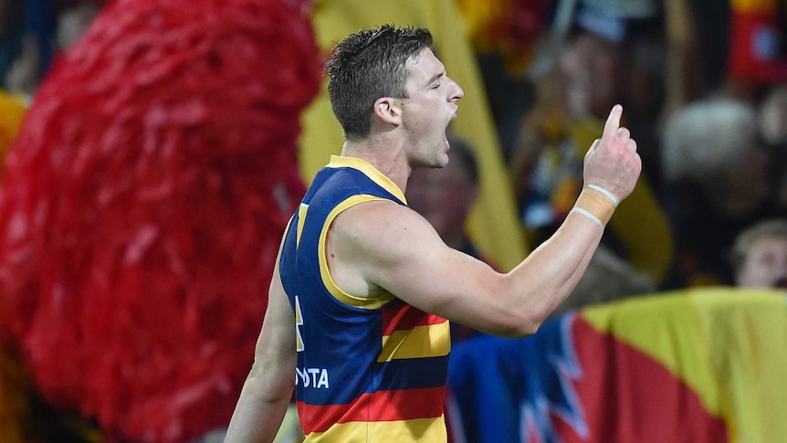 Adelaide's Josh Jenkins celebrates a Crows goal against the Sydney Swans at Adelaide Oval.