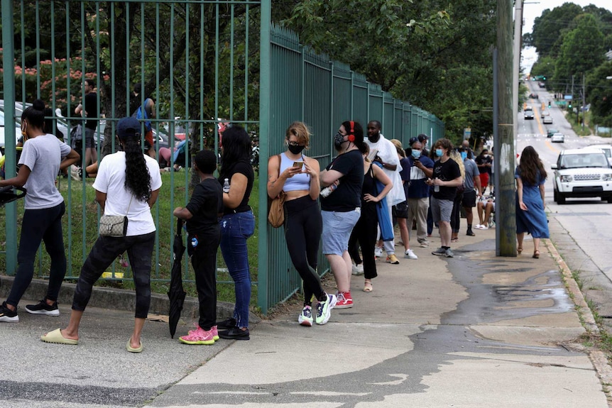 Voters line up outside polling boohts in Georgia