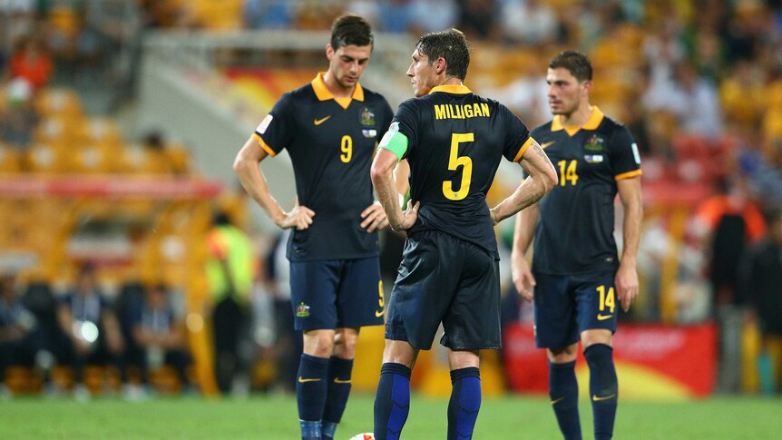 Milligan looks on during Asian Cup clash with South Korea