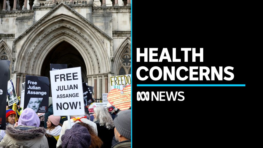 Health Concerns: People holding placards supporting Julian Assange outside UK High Court