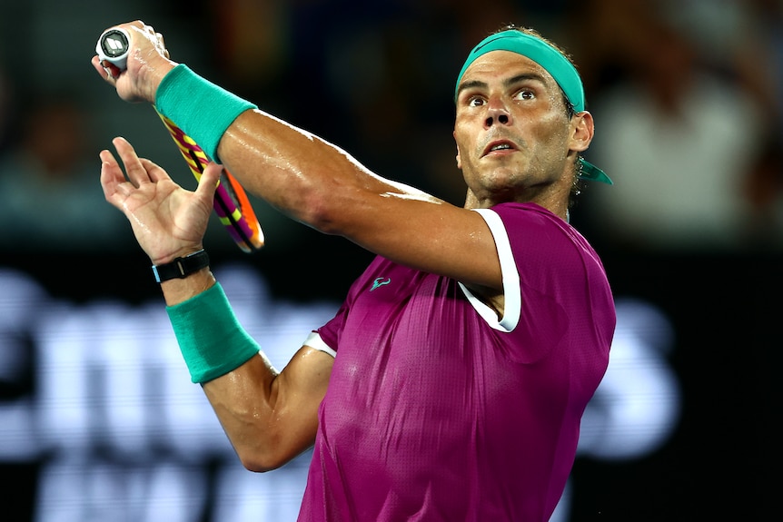 A Spanish male tennis player prepares to play a backhand at the Australian Open.