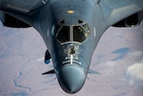 A Rockwell B-1 bomber aircraft in flight.