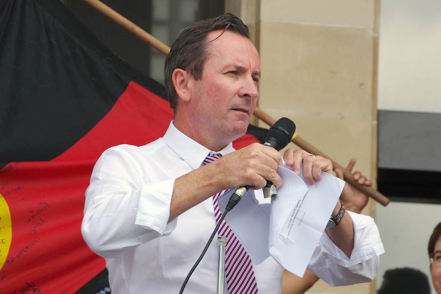 Labor Leader Mark McGowan tears up a copy of the Government's proposed anti-protest laws at a protest at Parliament House.