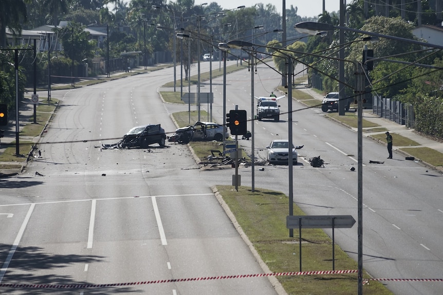 The Alawa crash as scene from a higher vantage point shows two crashed vehicles and debris across an intersection.