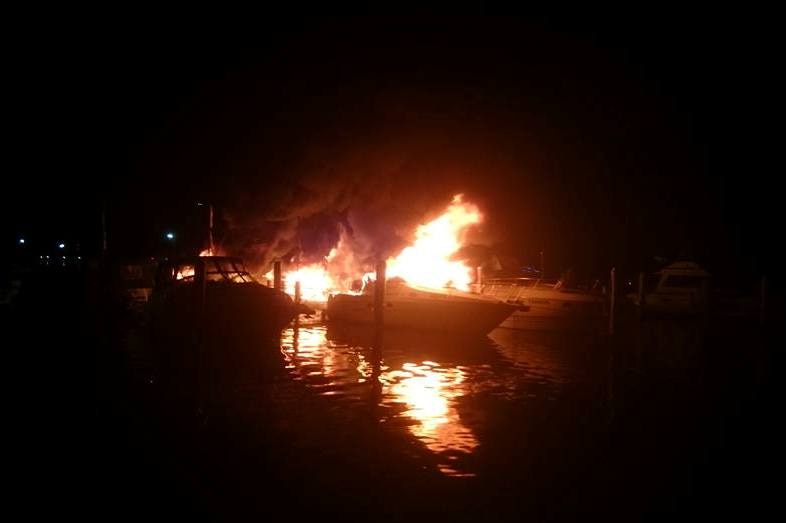 A fire tears through several boats at a Lake Macquarie marina
