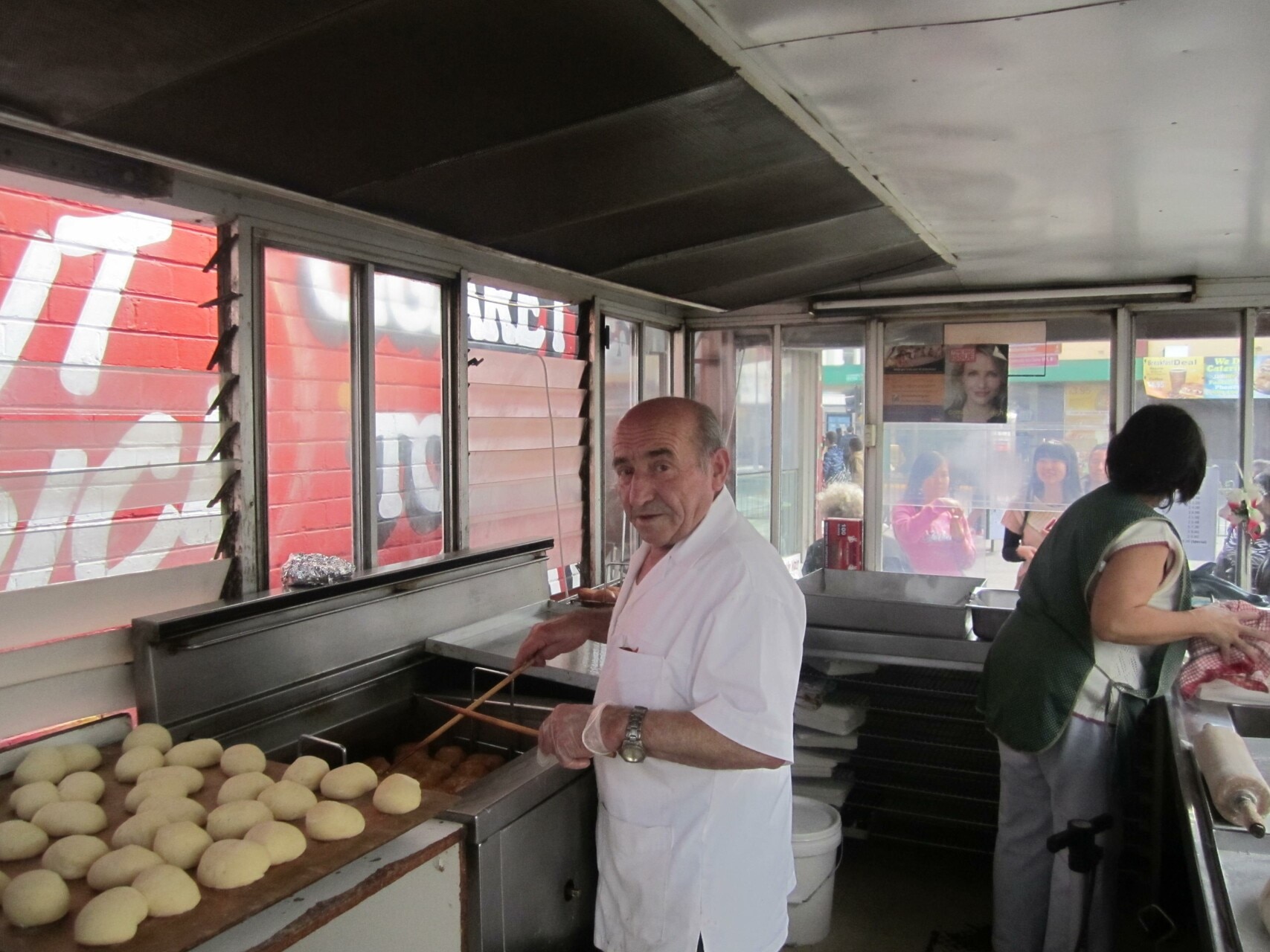 The late Nick Tsiligiris pictured inside his Olympic Doughnuts van at Footscray