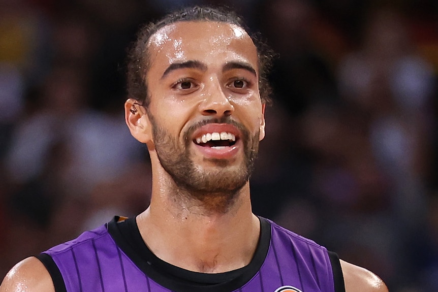 Xavier Cooks smiles during game five of the NBL grand final series.