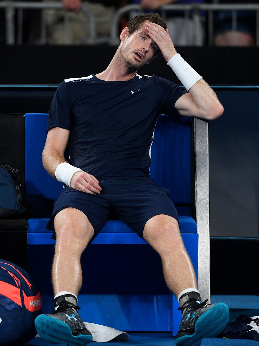 Andy Murray slumps in his chair exhausted after his first-round Australian Open loss