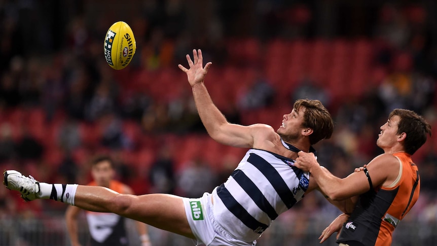 GWS' Phil Davis (R) competes for the ball against Geelong's Tom Hawkins on July 19, 2014.