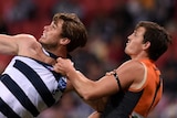 GWS' Phil Davis (R) competes for the ball against Geelong's Tom Hawkins on July 19, 2014.