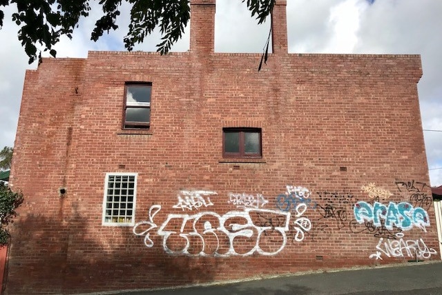 SMUG mural wall in North Hobart before the artwork