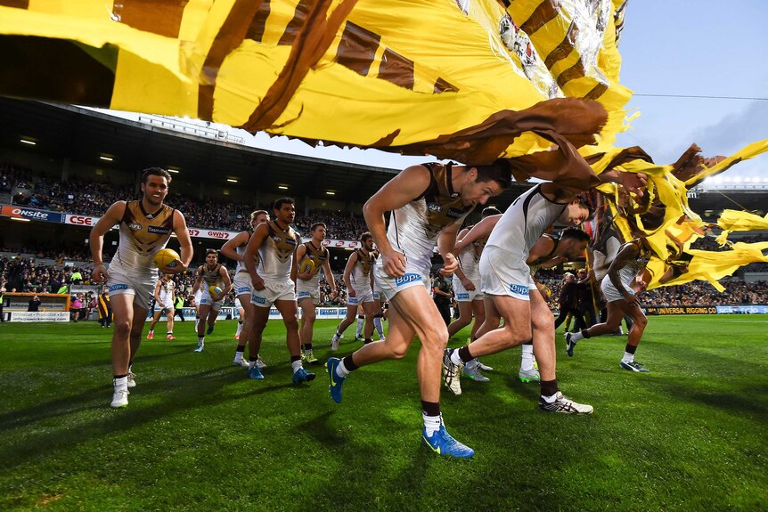 James Frawley leads out the Hawthorn Hawks at Subiaco Oval