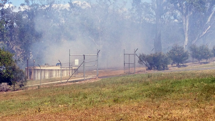 Smoke from a bushfire drifts towards Bellbrook