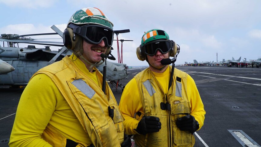 Crew on board the US aircraft carrier Carl Vinson in the South China Sea.