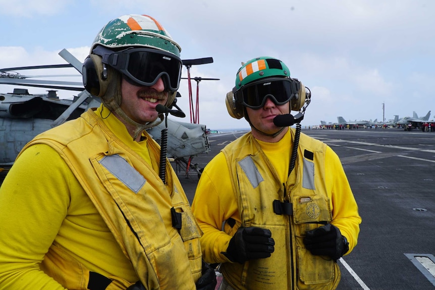 Crew on board the US aircraft carrier Carl Vinson in the South China Sea.