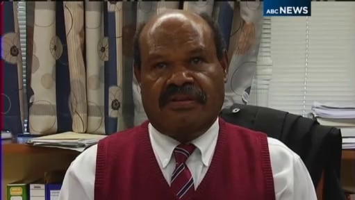 TV still of PNG chief justice Sir Salamo Injia speaking to media in his office.