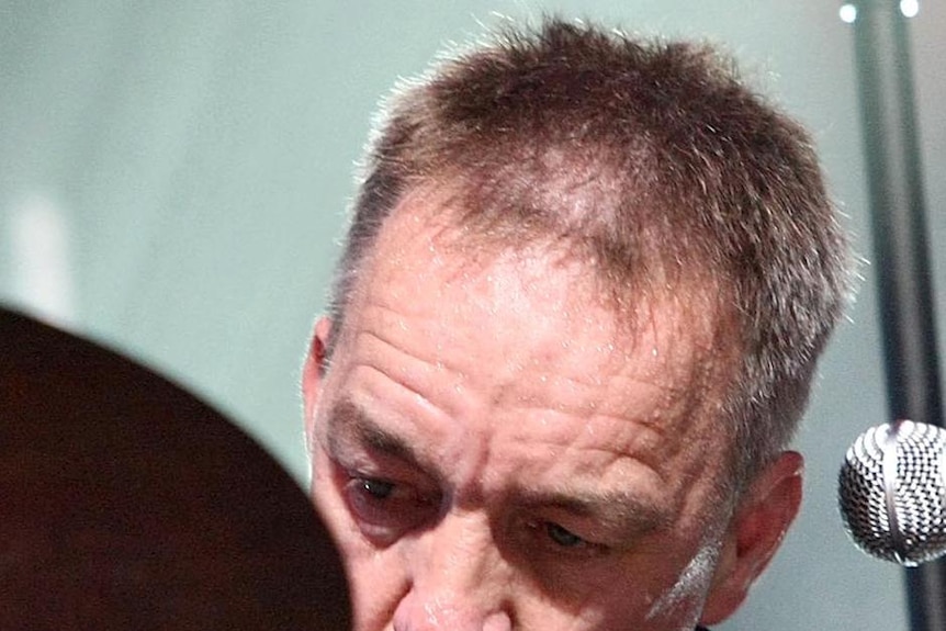 Steve Prestwich pounds the drums during a Cold Chisel concert in Sydney in 2009