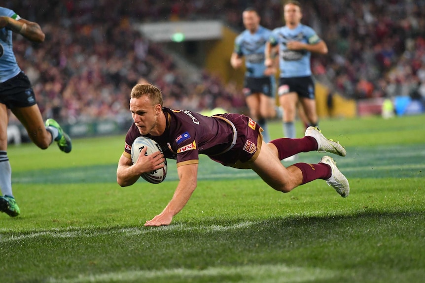 Daly Cherry-Evans dives in for a try for Queensland.