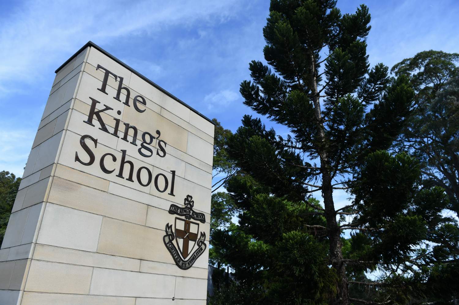 A sign outside a school.