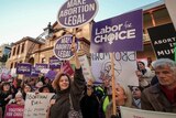 Supporters of abortion decriminalisation outside NSW State Parliament this morning.