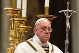 The Pope holding a staff depicting a crucifix