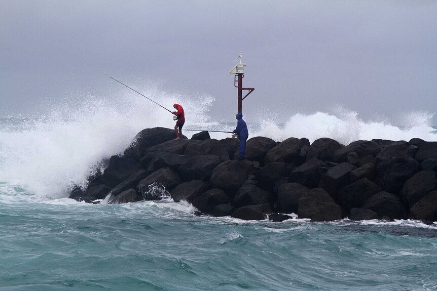 Rock fishermen try to make the most of wild conditions at Kingscliff