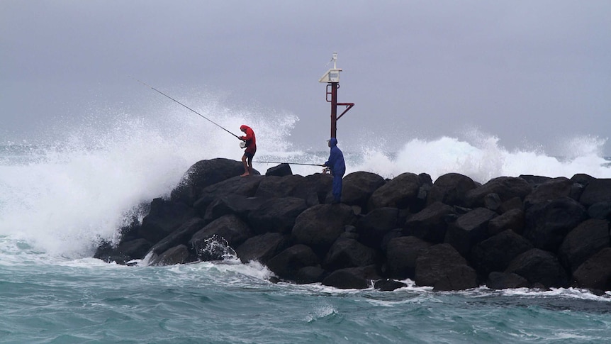 Rock fishermen try to make the most of wild conditions at Kingscliff