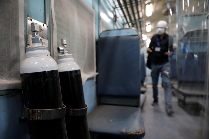 Oxygen cylinders in the coach of a passenger train equipped to care for COVID-19 patients.