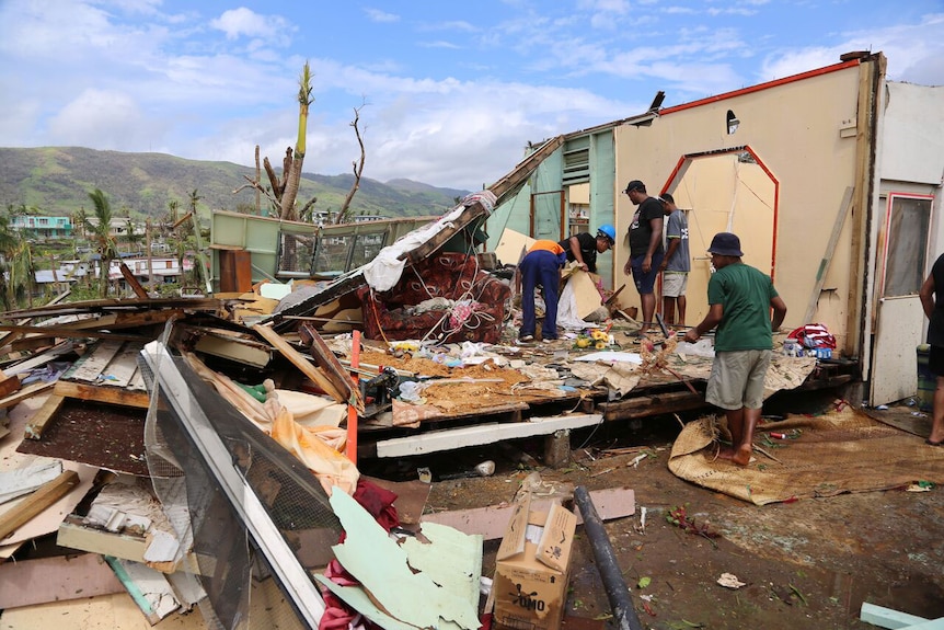 Fijians search through destroyed home in Rakiraki