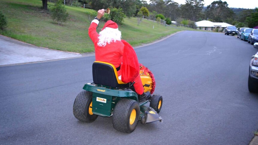 Santa Claus on his lawnmower